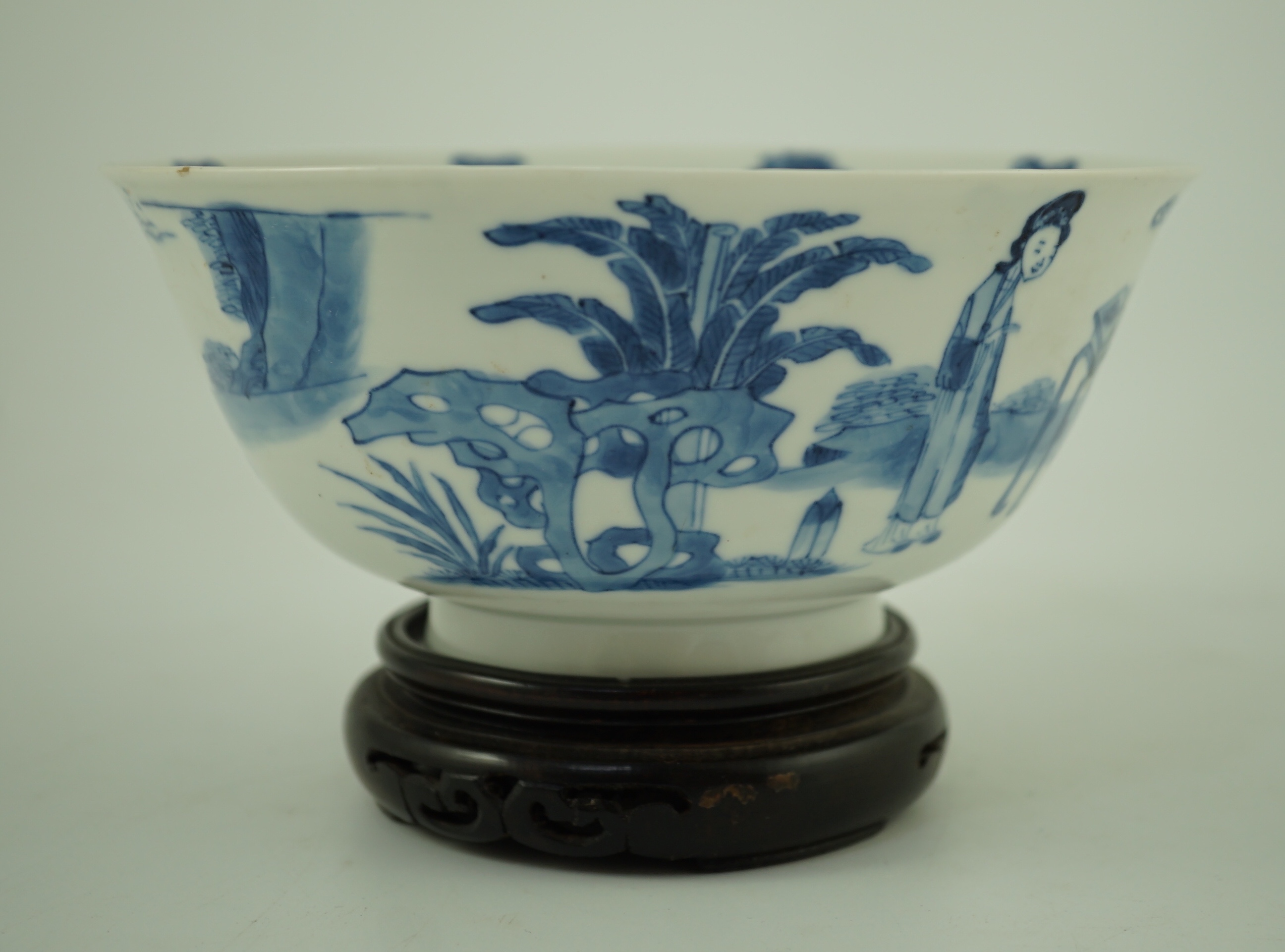 A Chinese blue and white ‘ladies’ bowl, Kangxi period, 15.5cm diameter, wood stand